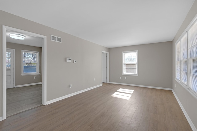 unfurnished room with light hardwood / wood-style flooring