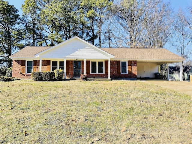 single story home featuring a front lawn and a carport