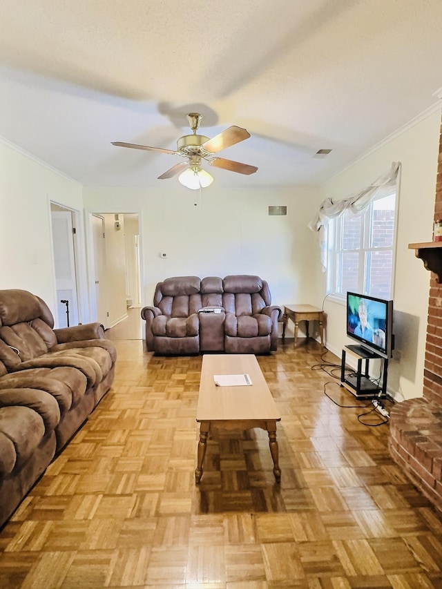 living room featuring ceiling fan, crown molding, and light parquet floors