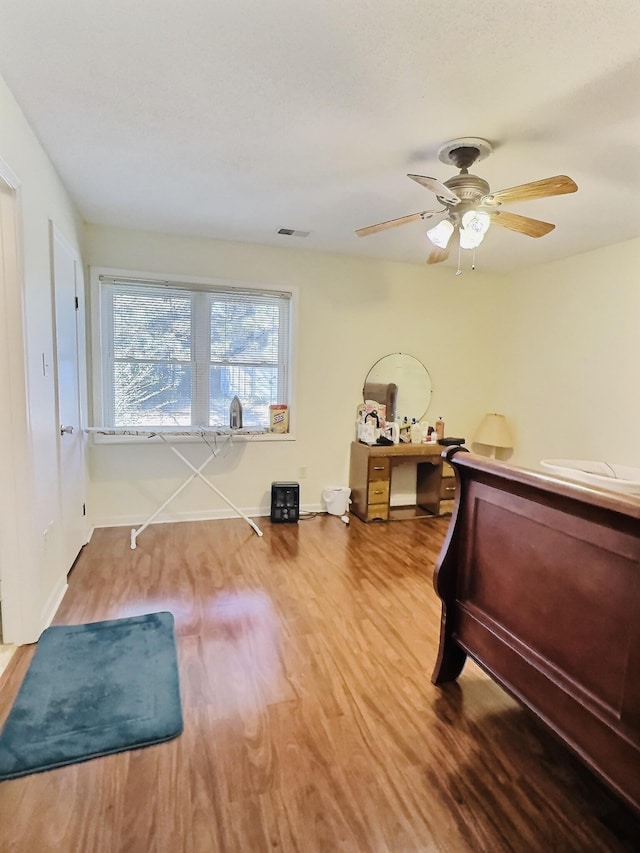 bedroom featuring ceiling fan and wood-type flooring