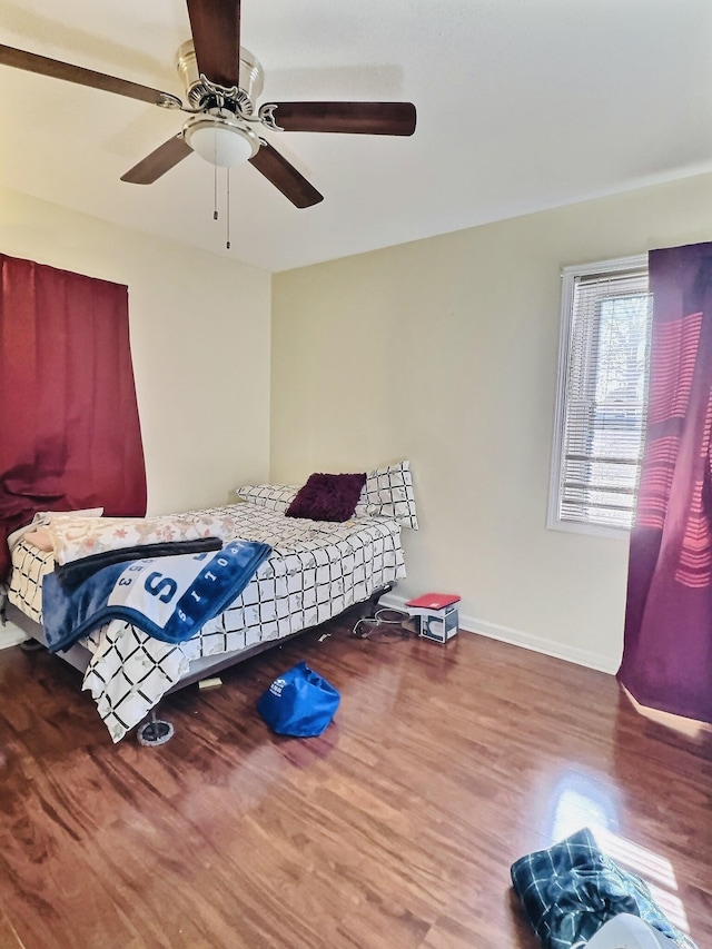 bedroom featuring hardwood / wood-style floors and ceiling fan