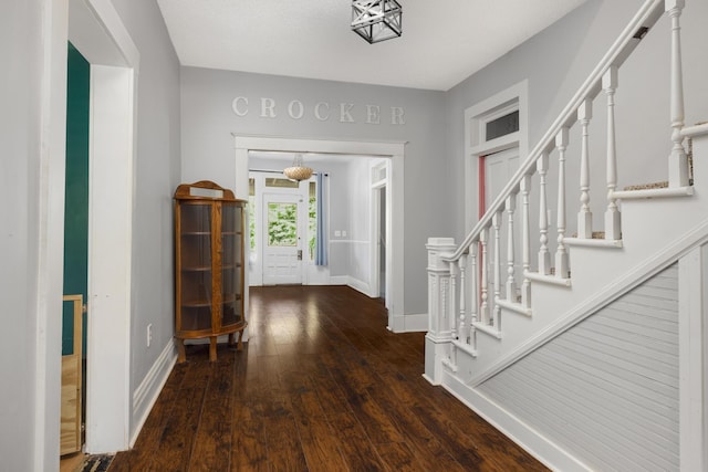 foyer with dark hardwood / wood-style flooring