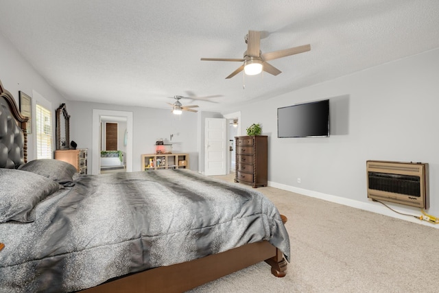 bedroom featuring heating unit, ceiling fan, a textured ceiling, and carpet