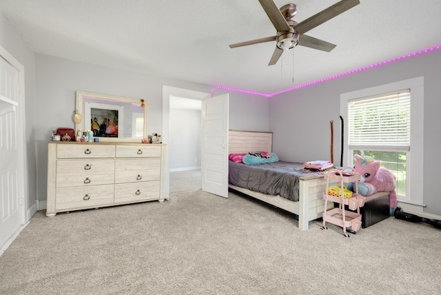 carpeted bedroom with ceiling fan