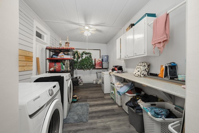 laundry area featuring cabinets, dark hardwood / wood-style flooring, and separate washer and dryer