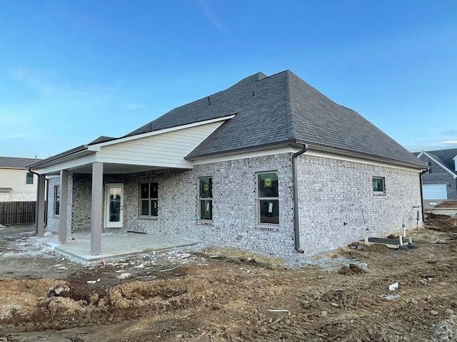 rear view of property with a patio area