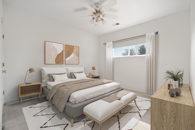 carpeted bedroom with ceiling fan