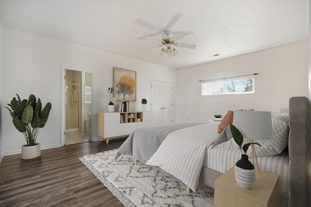 bedroom featuring ceiling fan, ensuite bathroom, and dark hardwood / wood-style flooring