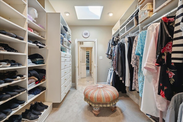 spacious closet featuring a skylight