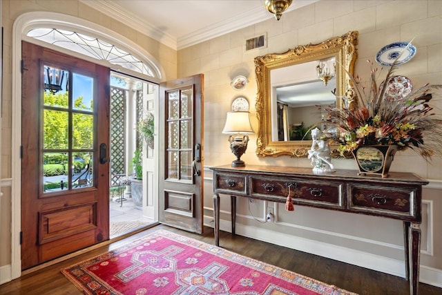 entrance foyer with crown molding and dark hardwood / wood-style floors