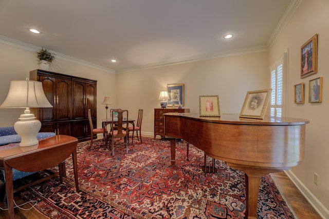 miscellaneous room with crown molding and hardwood / wood-style flooring