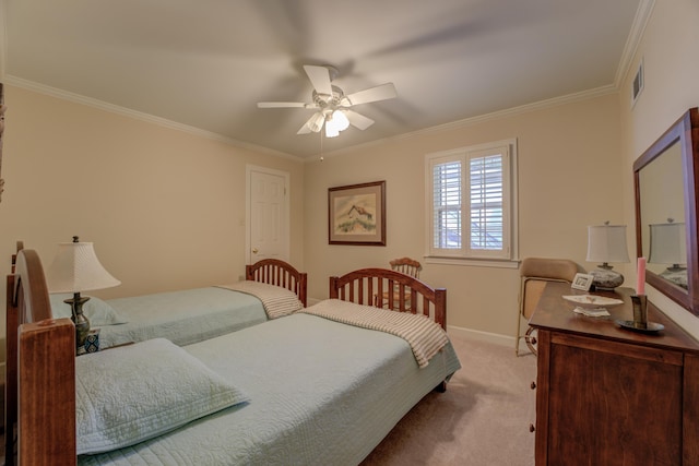 carpeted bedroom featuring crown molding and ceiling fan