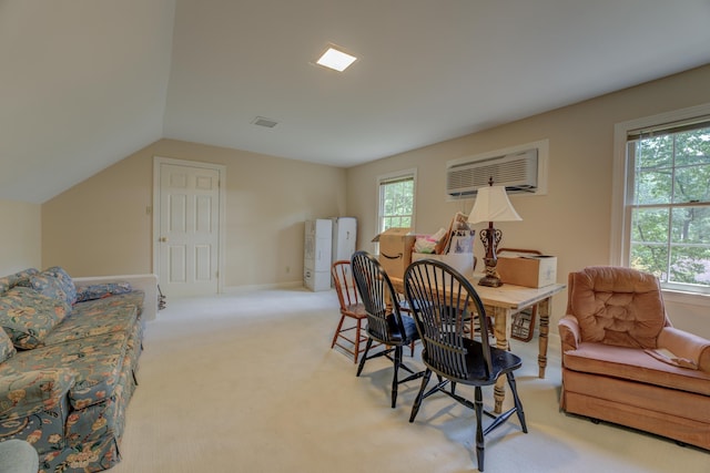 home office with light colored carpet, lofted ceiling, and a wall unit AC