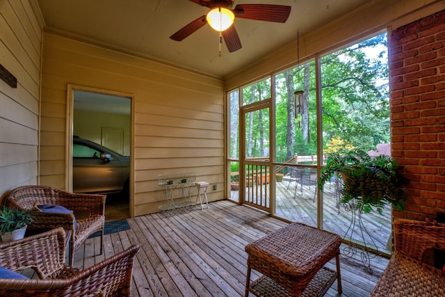 sunroom / solarium with ceiling fan and plenty of natural light