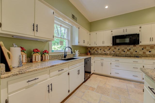 kitchen with white cabinetry, sink, light stone counters, and black appliances