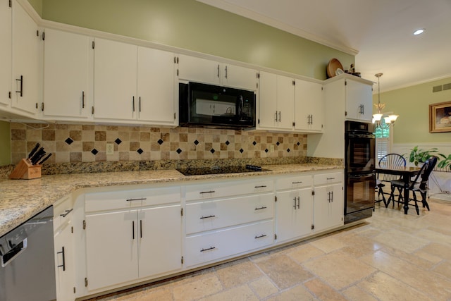 kitchen with crown molding, white cabinets, hanging light fixtures, and black appliances