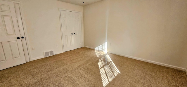 empty room featuring carpet flooring