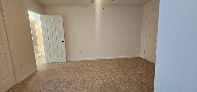 empty room featuring light colored carpet