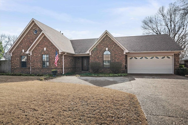 view of front facade with a garage and a front yard