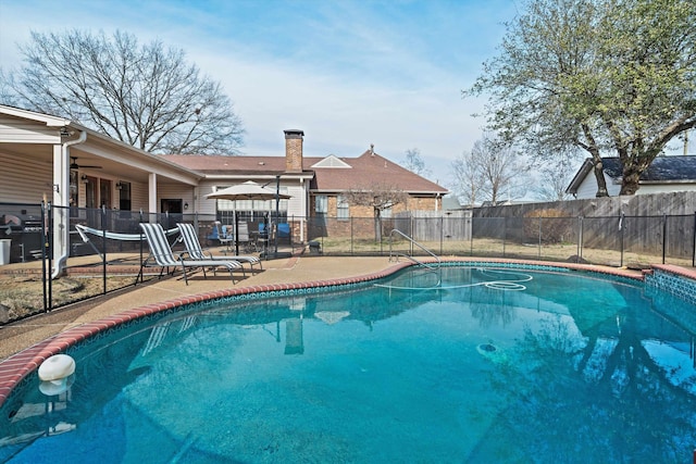 view of swimming pool with a patio