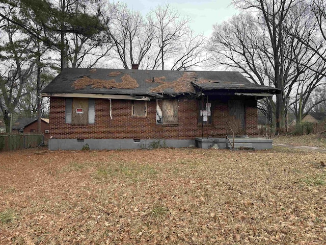 view of side of home with a lawn