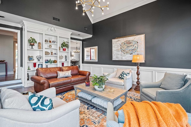 living room with crown molding, wood-type flooring, high vaulted ceiling, and a chandelier