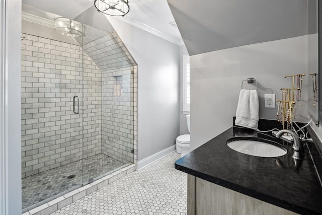 bathroom featuring tile patterned floors, toilet, a shower with shower door, crown molding, and vanity