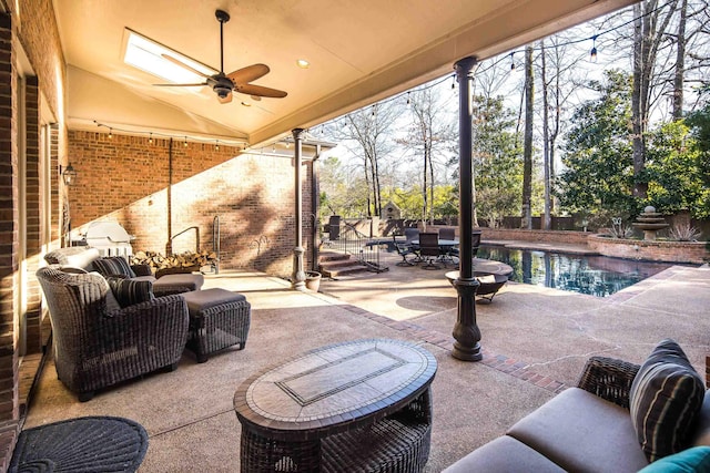 view of patio / terrace featuring an outdoor living space and ceiling fan