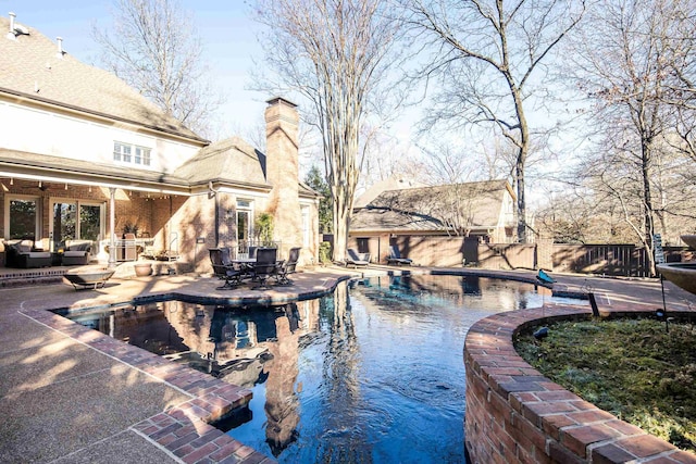 view of swimming pool with a patio and an outdoor hangout area