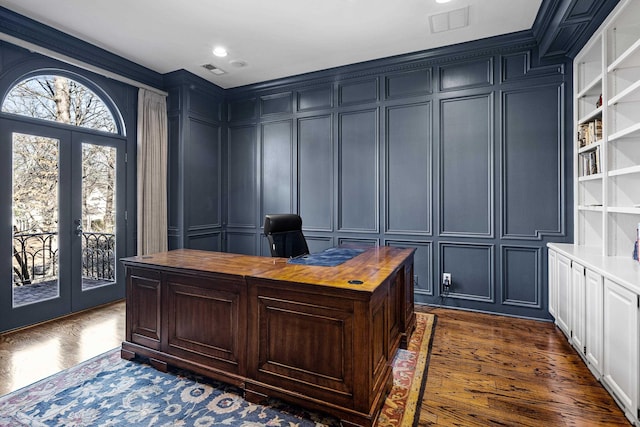 office featuring dark hardwood / wood-style flooring, built in features, and french doors