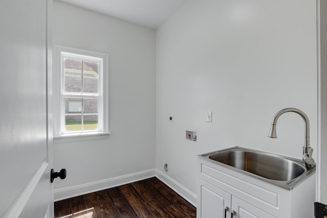 clothes washing area with sink, hookup for a washing machine, dark hardwood / wood-style floors, cabinets, and hookup for an electric dryer