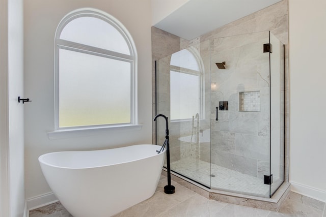 bathroom with shower with separate bathtub