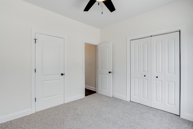 unfurnished bedroom featuring ceiling fan, carpet floors, and a closet