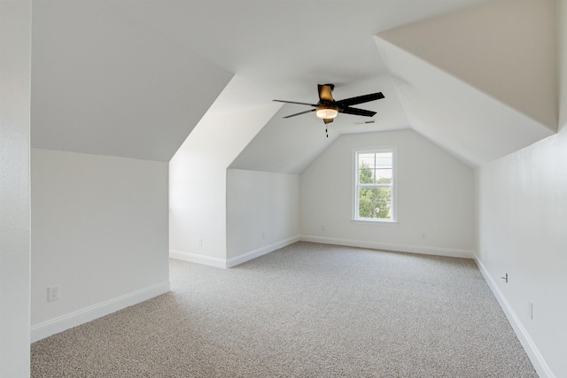 bonus room featuring light carpet, vaulted ceiling, and ceiling fan