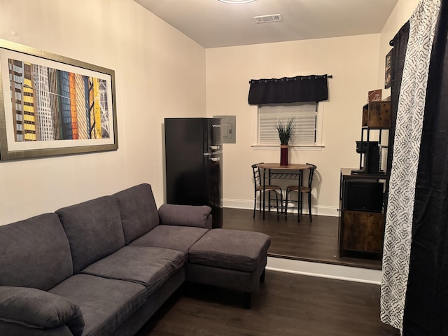 living room featuring dark hardwood / wood-style flooring