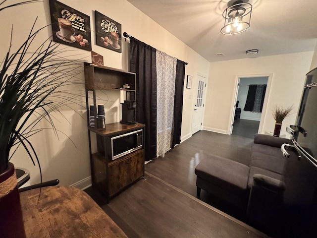 living room with dark wood-type flooring