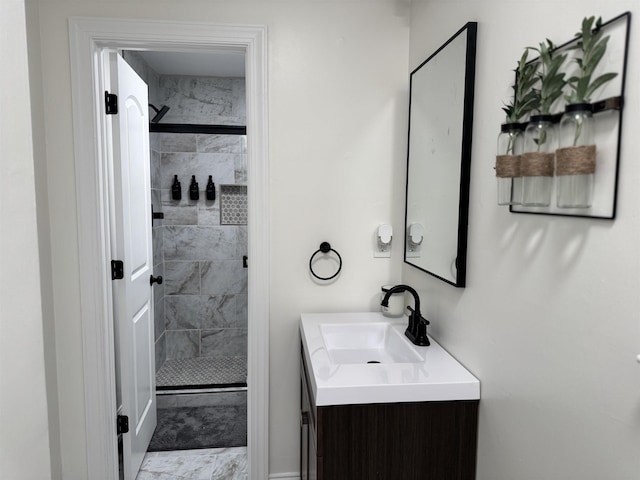 bathroom featuring vanity and a tile shower