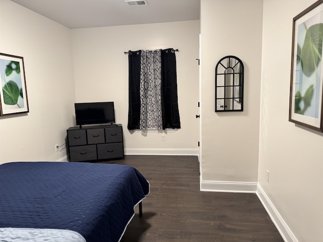 bedroom featuring dark hardwood / wood-style floors