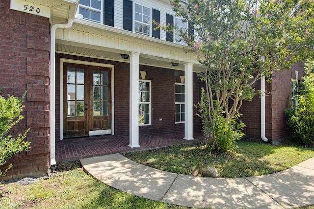 entrance to property featuring french doors and a porch