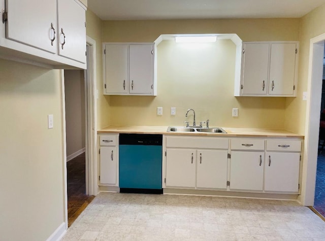 kitchen with dishwasher, sink, and white cabinets