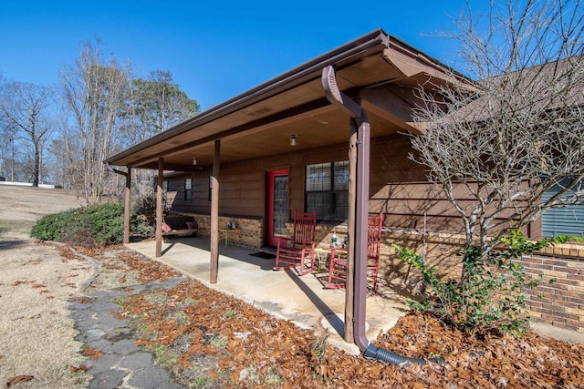 view of side of home with a patio