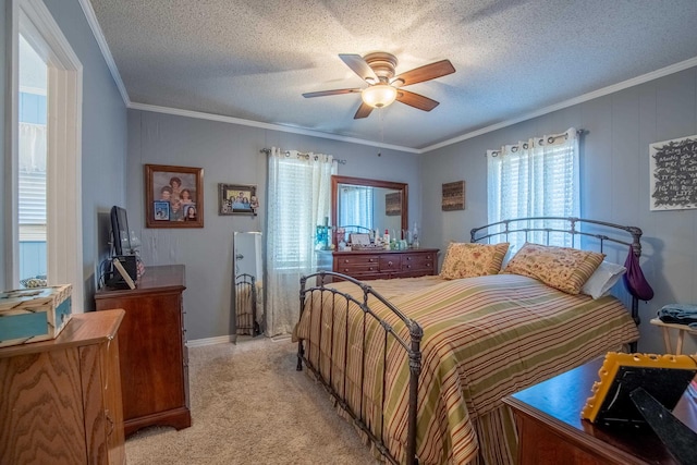 bedroom with light carpet, ceiling fan, crown molding, and a textured ceiling