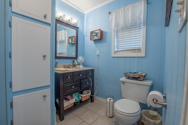 bathroom with vanity, crown molding, and toilet