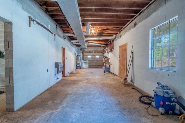 misc room featuring heating unit and concrete floors