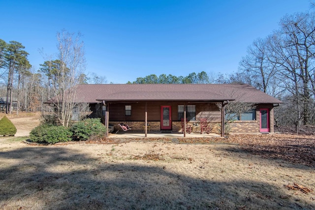 ranch-style home with a patio area and a front lawn