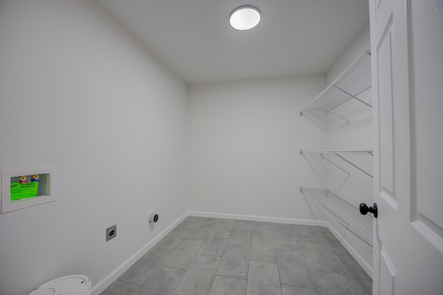 clothes washing area featuring hookup for a washing machine and electric dryer hookup