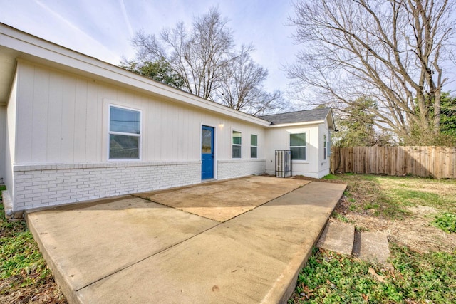 back of property with a patio