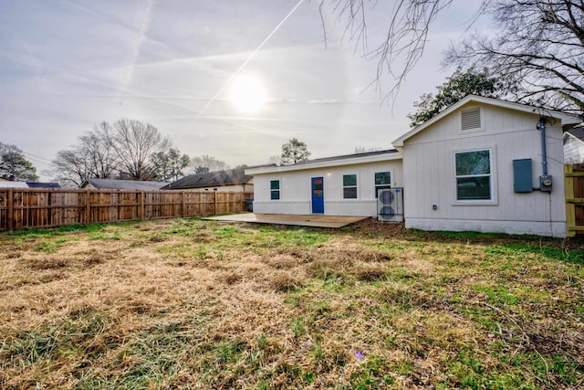 rear view of house with a yard and a patio area