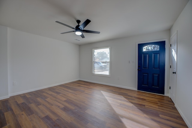 foyer with dark hardwood / wood-style flooring and ceiling fan