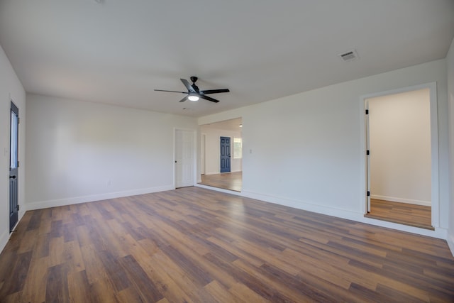 unfurnished room featuring ceiling fan and dark hardwood / wood-style floors